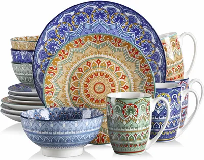 A collection of ceramic dinnerware with a bohemian mandala pattern.