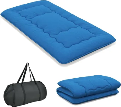 A blue floor mattress and a black duffel bag are shown against a white background.