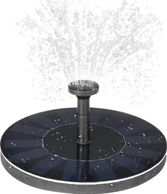 A solar-powered water fountain spraying water.