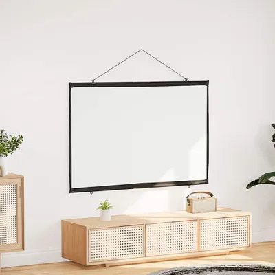 A projection screen is mounted on a white wall above a wooden media console.