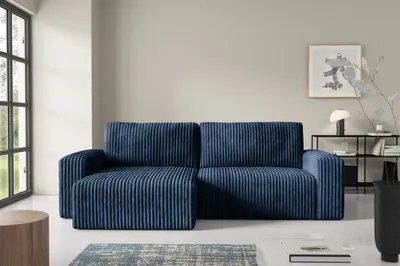 A dark blue corduroy sectional sofa is shown in a modern living room setting.