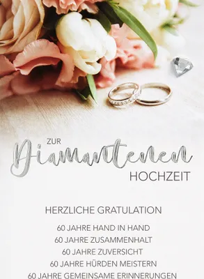 A greeting card with flowers and wedding rings.