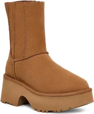 A single brown UGG boot with a platform sole is shown against a white background.
