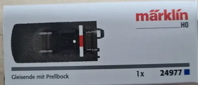 The image shows the packaging of a model train accessory.