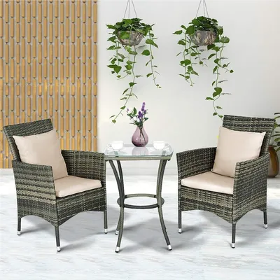 Image de Ensemble de mobilier de jardin composé de 3 pièces : une table et des chaises en résine tressée, avec des coussins confortables de couleur grise