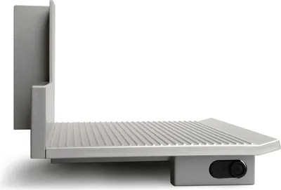 A side view of a gray food slicer attachment on a white background.