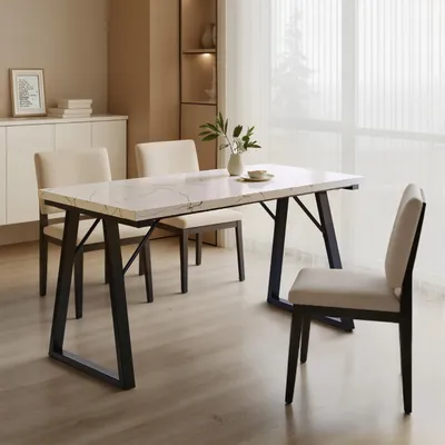 A dining room scene with a marble-top table and chairs.