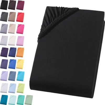 A black fitted sheet is shown folded with its elastic edge visible.