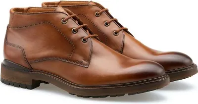 A pair of brown leather chukka boots.