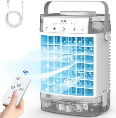 A portable air cooler with a remote control and USB cable.