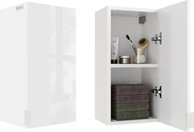 A white bathroom cabinet with its door open, displaying towels and toiletries.