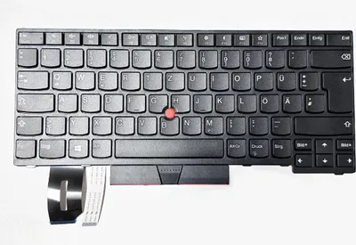 A black laptop keyboard with a red trackpoint is shown from a top-down view on a white background.