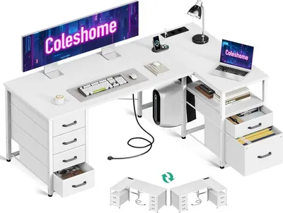 A white L-shaped desk with multiple drawers and shelves, set up with computer equipment.