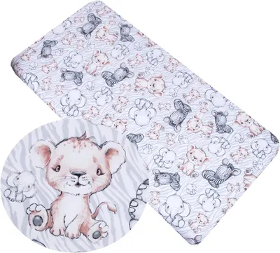 A close-up view of a baby blanket with a safari animal print, featuring a detailed illustration of a lion cub.