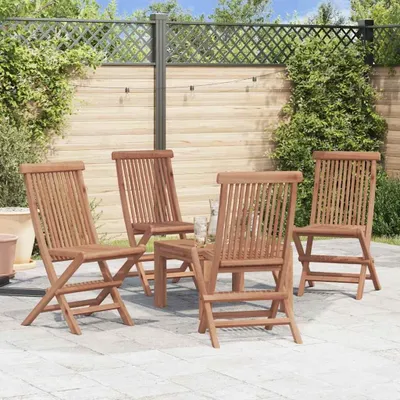 A patio setting with wooden chairs and a table.
