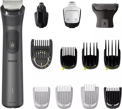 A collection of grooming tools and attachments, including a main trimmer, nose trimmer, and various comb attachments, laid out on a white background.
