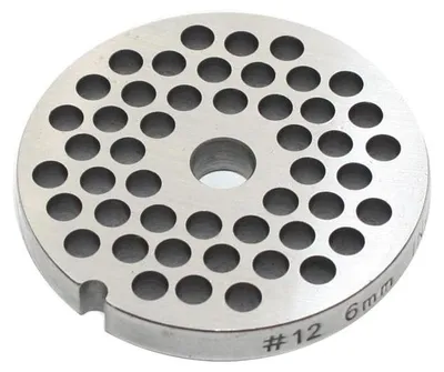 A close-up, top-down view of a metal grinder plate with multiple holes.