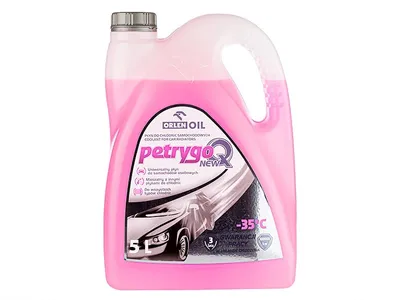 A pink liquid coolant in a large plastic container.