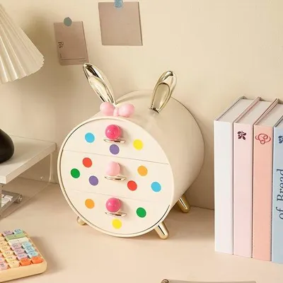 Imagen del producto de Cajas de maquillaje de plástico color crema, ideales para habitaciones de niñas