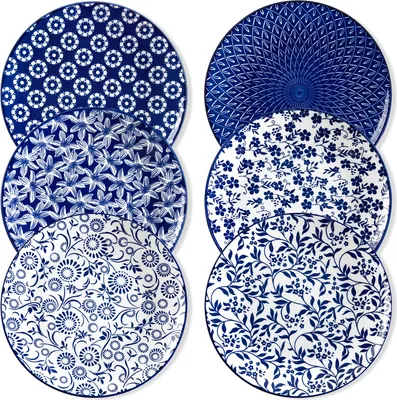 A collection of six blue and white patterned plates.