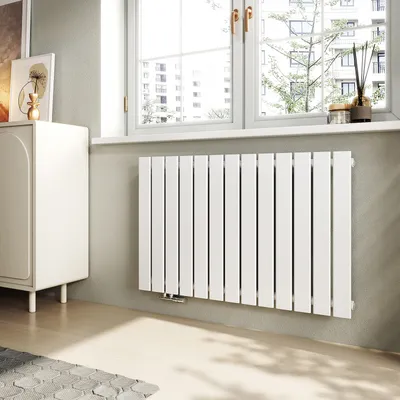 A modern living room with a white radiator under a window.