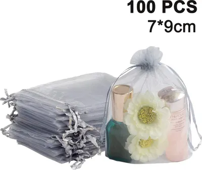 Produktbild von 100 Stück durchsichtige Schmuckbeutel mit Kordelzug, ideal als Gastgeschenke für Hochzeiten, Partys und Weihnachten.