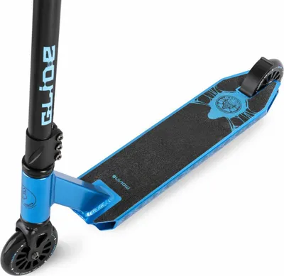A close-up, angled view of a blue and black stunt scooter, focusing on the deck and front wheel.