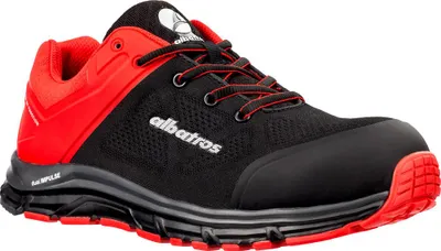 A studio shot of a single black and red safety shoe.