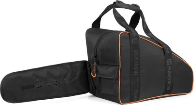 A black chainsaw bag with orange trim and straps, shown with a black chainsaw scabbard attached.