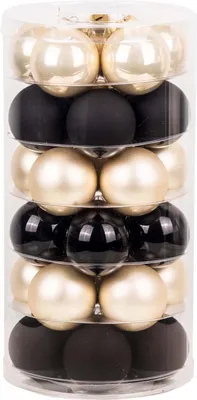 A clear, studio shot of a cylindrical container filled with Christmas ornaments.