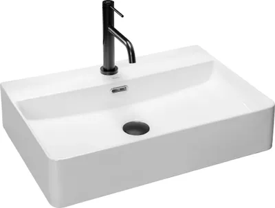 A white rectangular sink with a black faucet, shown from a diagonal angle against a white background.
