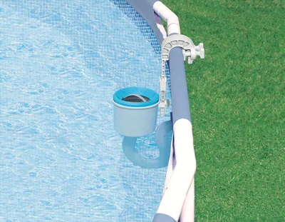 A skimmer attached to the side of an above-ground swimming pool.