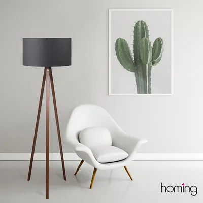 A modern living room scene with a floor lamp, a chair, and a framed cactus print on the wall.