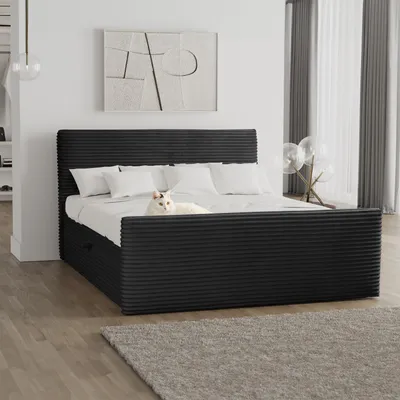 A bedroom scene with a black bed, white bedding, and a white cat.