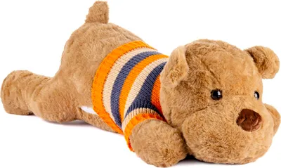 A plush teddy bear lying on its stomach, wearing a striped sweater.