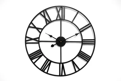 A black metal wall clock with Roman numerals on a white background.