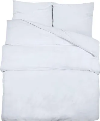 A white duvet and pillow set laid out flat on a white background.