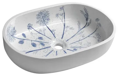 A white oval sink with a blue floral pattern inside.
