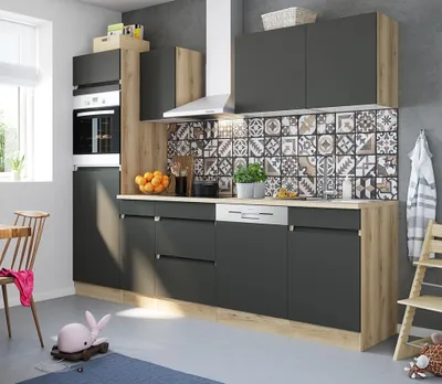 A modern kitchen setup with dark gray cabinets, a patterned backsplash, and wooden accents.