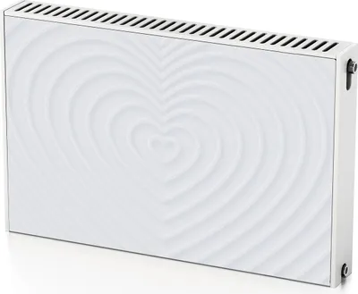 A white radiator cover with a raised heart pattern, viewed from a diagonal angle.