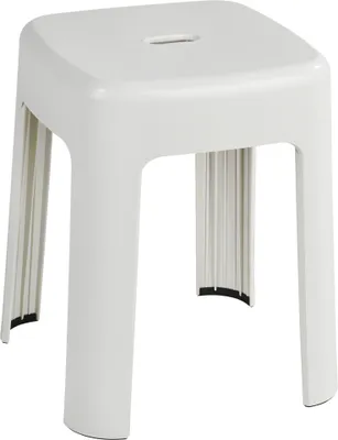A white plastic stool on a white background.