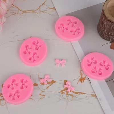 Produktbild von 4 Stück Schleifenfondantformen - Mini Silikon Fondantform Schleife - Süßigkeiten Schokolade DIY Tortendekoration für Geburtstag Hochzeit Fest