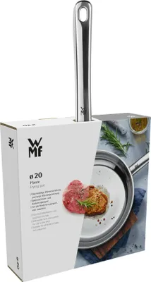 A frying pan in its packaging, with a piece of steak and rosemary shown on the packaging.
