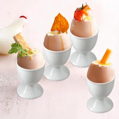 Immagine prodotto di Set di 4 portauova in porcellana bianca, ideali per la colazione, adatti sia per uova sode che alla coque
