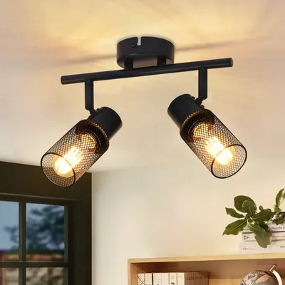 A black metal ceiling light fixture with two adjustable spotlights is mounted on a white ceiling.