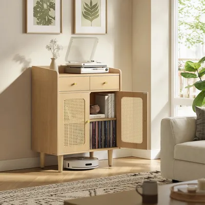 A living room scene with a wooden sideboard, a record player, and a sofa.