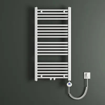 A white electric towel radiator mounted on a dark gray wall, with its coiled power cord connected to a wall socket.
