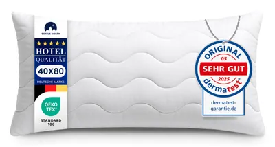 A white pillow with labels attached.