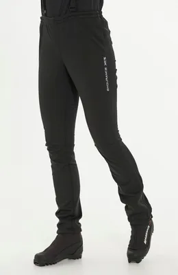 A person wearing black pants and boots against a white background.
