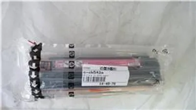 A clear plastic bag containing several toner cartridges.